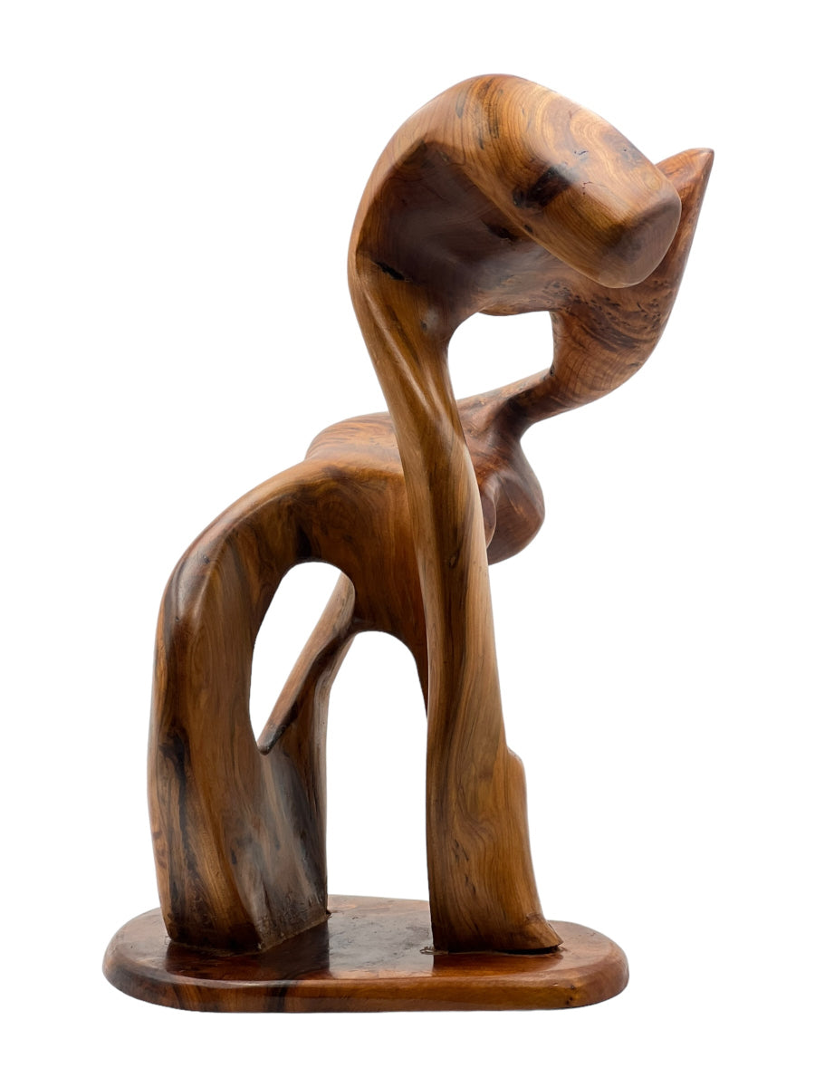 Wooden abstract sculpture on a white background