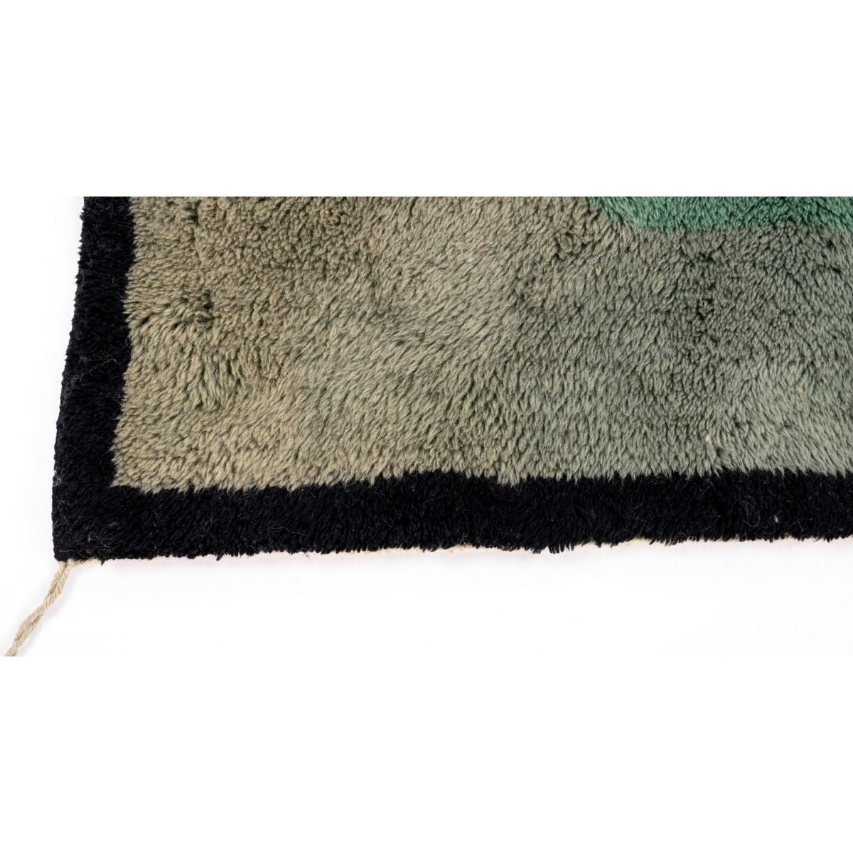 Close-up of a handmade Moroccan rug with gradient colors