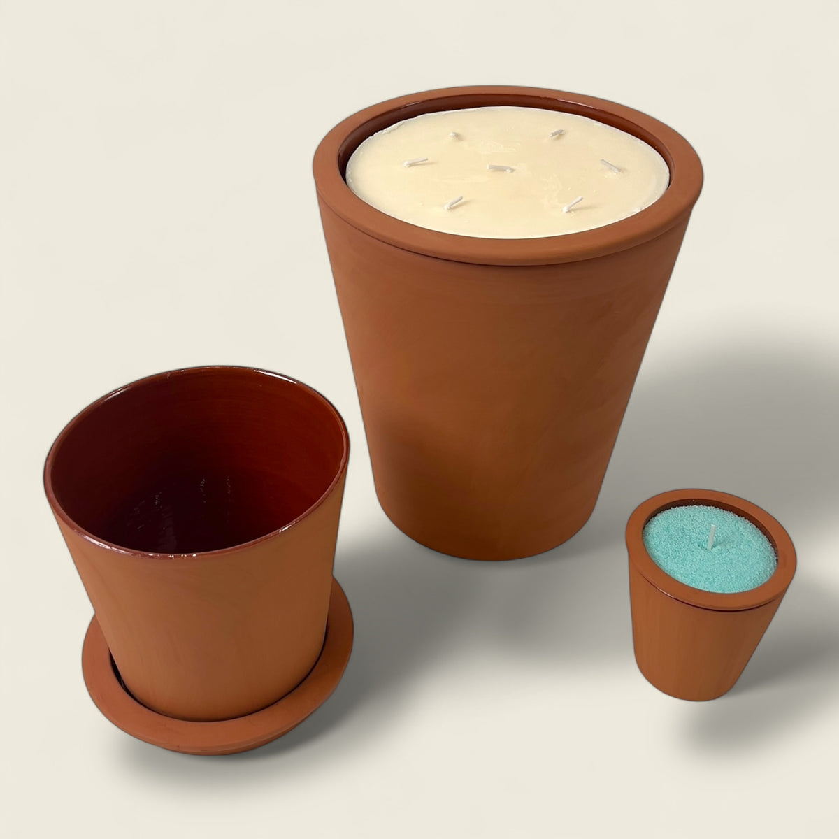 A stunning set of Nora Brute candles, each poured into a handcrafted Moroccan clay pot made from organic red clay and finished in raw terracotta. Artfully shaped in Marrakesh without molds or machines, these vessels embody authentic craftsmanship and sustainable design. The natural matte texture and earthy hue make this set ideal for bohemian, minimalist, or organic-inspired interiors. Available in multiple sizes, this candle collection radiates timeless warmth and elegance a true reflection of Dary Living