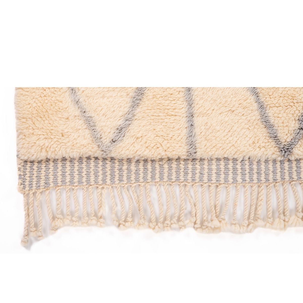Close-up of a textured rug with geometric pattern