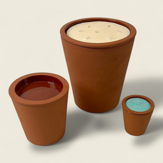 Introducing the Nora Brute Moroccan Candle — a pure expression of heritage and simplicity. Each handmade Moroccan clay pot, crafted in small, medium, and large sizes, is skillfully hand-shaped in Marrakesh using organic red clay and finished in natural raw terracotta. Filled with natural sand wax, this candle offers a clean, radiant burn that evokes warmth, earthiness, and grounded beauty. A timeless addition to any interior, this piece is both functional and sculptural, blending sustainability with authent