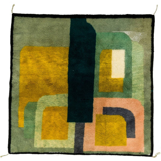 A handmade Moroccan rug featuring geometric patterns in green, yellow, and other colors with a minimalist design.